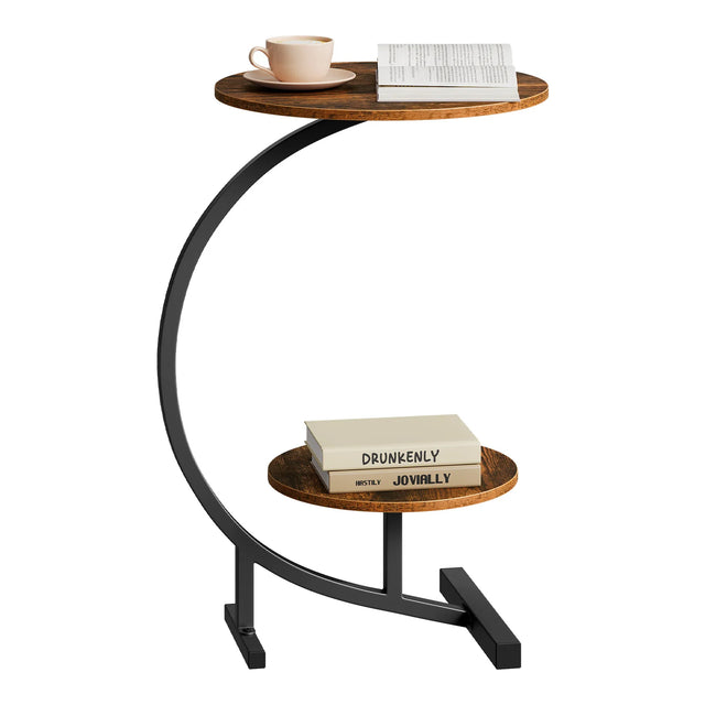 Rustiek bruine ronde bijzettafel met twee bladen en zwart gebogen frame, met kopje en boeken
