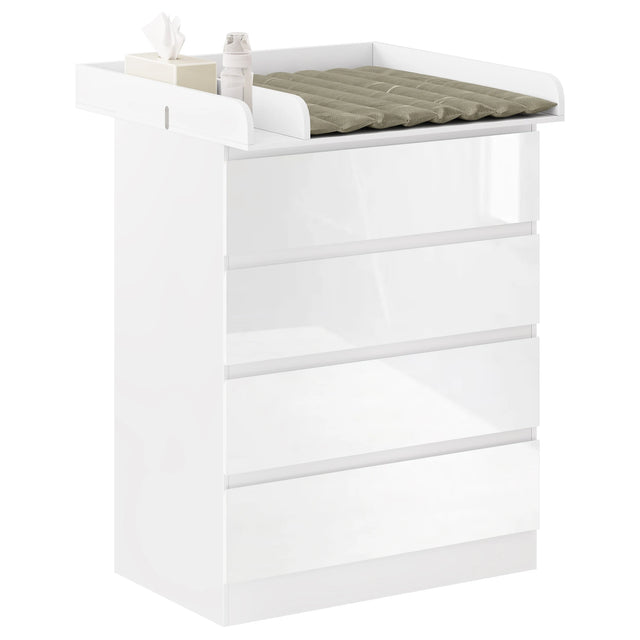 Witte babycommode met vier lades en aankleedopzetstuk, gefotografeerd van voren en opzij