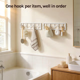 BukkitBow wandkapstok met draaibare metalen haken en jashouder, geschikt voor het ophangen van jassen en accessoires.
