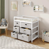 Moderne BukkitBow commode in wit en grijs met 6 laden en aankleedblad, geschikt voor slaapkamer of kinderkamer.
