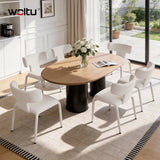 Set van 2 moderne BukkitBow eetkamerstoelen met metalen onderstel en wielen, strak design en comfortabele zitting.