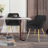 Moderne velvet eetkamerstoel van BukkitBow met armleuningen en metalen poten, comfortabele en stijlvolle zitplaats.