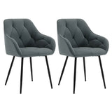 Twee velvet en metalen eetkamerstoelen van BukkitBow met ergonomisch ontwerp en 120 kg draagvermogen, geschikt voor de eetkamer.